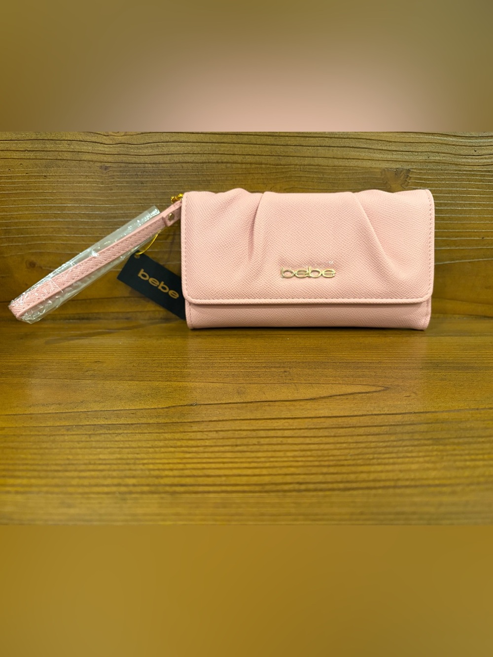 bebe Blush Pink Fold-Over Wristlet Clutch with Gold Logo